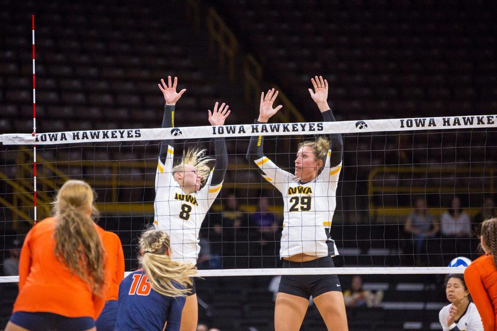 Iowa Hawkeye Volleyball players Jess Janota and Reghan Coyle try to defend the net during a match against the University of Illinois Fighting Illini on Friday, Oct. 19, 2017. The Illini defeated the Hawkeyes three sets to two. 