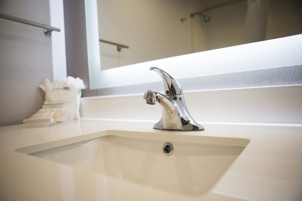 A bathroom sink is seen during a ribbon cutting event for the Hilton Garden Inn on Clinton Street on Thursday, Nov., 30, 2017. The 12th floor of the hotel features a rooftop bar and restaurant that is open to the public. The hotel opened in October. (Joseph Cress/The Daily Iowan)