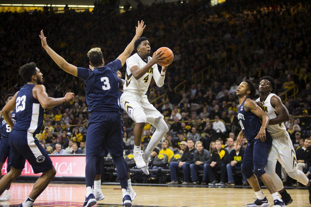 Iowa guard Isaiah Moss attempts a shot past Penn State forward Satchel Pierce during an Iowa/Penn State mens basketball game in Carver-Hawkeye Arena on Saturday, Dec. 2, 2017. The Nittany Lions defeated the Hawkeyes, 77-73. (Joseph Cress/The Daily Iowan)