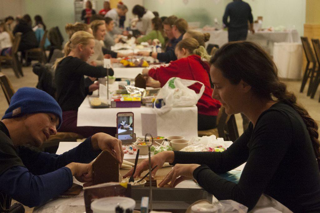 Competitors begin decorating during a gingerbread decorating competition at hotelVetro on Sunday, Dec. 10, 2017. Students, children, and community members were invited to participate in the annual holiday competition. Many community members had competed before, most bringing their own ingredients. (Katie Goodale/The Daily Iowan)