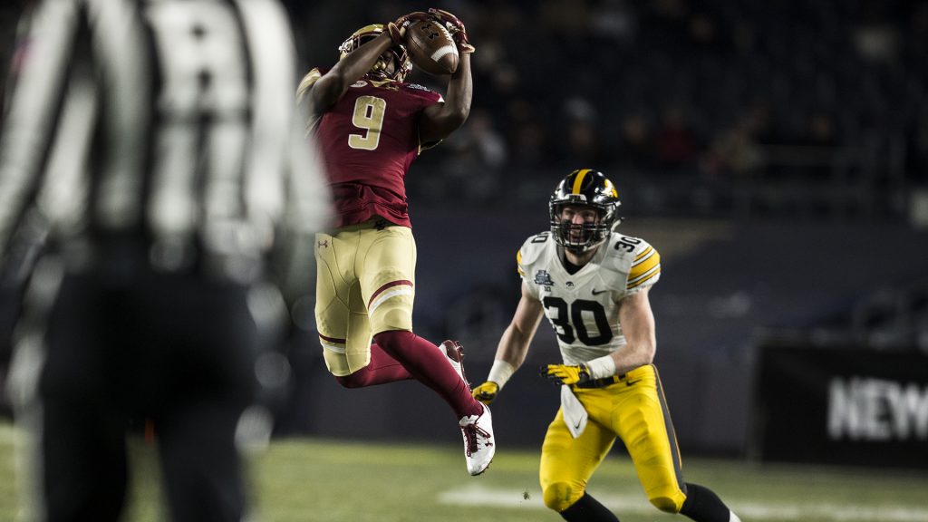Boston College wide receiver Kobay White (9) catches the ball over Iowas Jake Gervase (30) during the first half of the New Era Pinstripe Bowl at Yankee Stadium in New York on Wednesday, Dec. 27. 