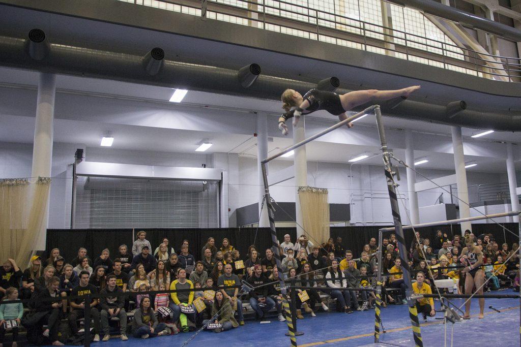 A gymnast competes during the Black and Gold Intrasquad meet at the Field House on Saturday, Dec. 2, 2017.  The Gold team defeated the Black team, 13-7. (Lily Smith/The Daily Iowan)
