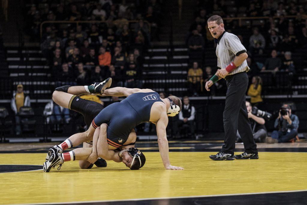 Iowa+wrestler+Michael+Kemerer+wrestles+against+Illinois%E2%80%99+Kyle+Langenderfer+during+a+meet+at+Carver+Hawkeye+Arena+on+Friday%2C+Dec.+1%2C+2017.+The+Hawkeyes+defeated+the+Illini+18-17.+%28Nick+Rohlman%2FThe+Daily+Iowan%29