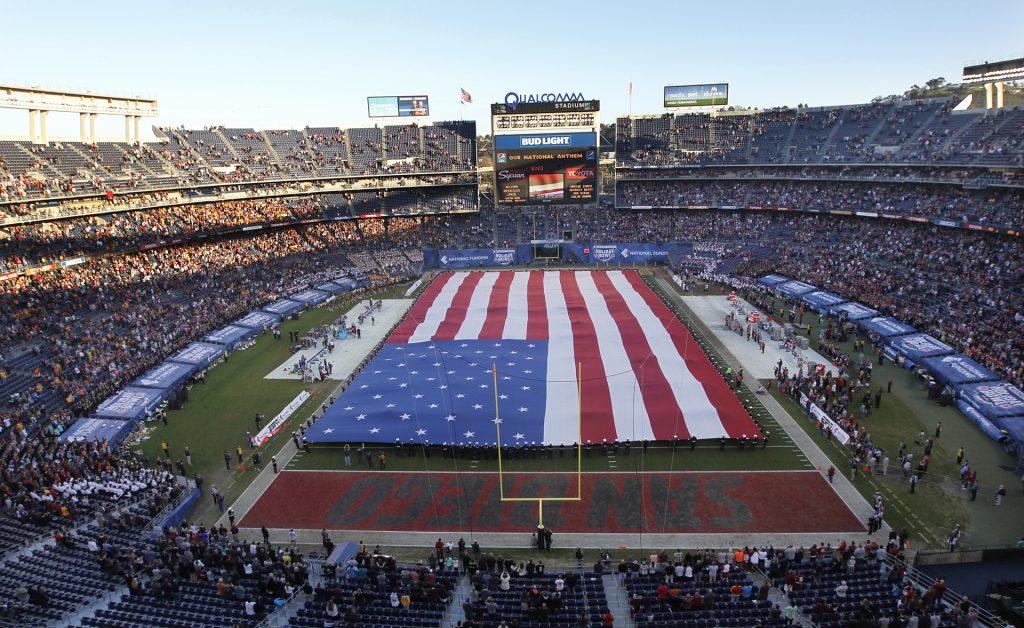 A giant U.S. flag is unfurled during the national anthem before Minnesota plays Washington State in the Holiday Bowl at Qualcomm Stadium in San Diego on Tuesday, Dec. 27, 2016. (K.C. Alfred/San Diego Union-Tribune/TNS)