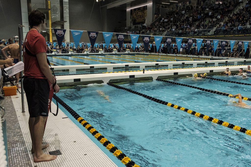 A life guard watches the pool during the USA Swimming West Junior Nationals on Saturday Dec. 9, 2017. (Nick Rohlman/The Daily Iowan)