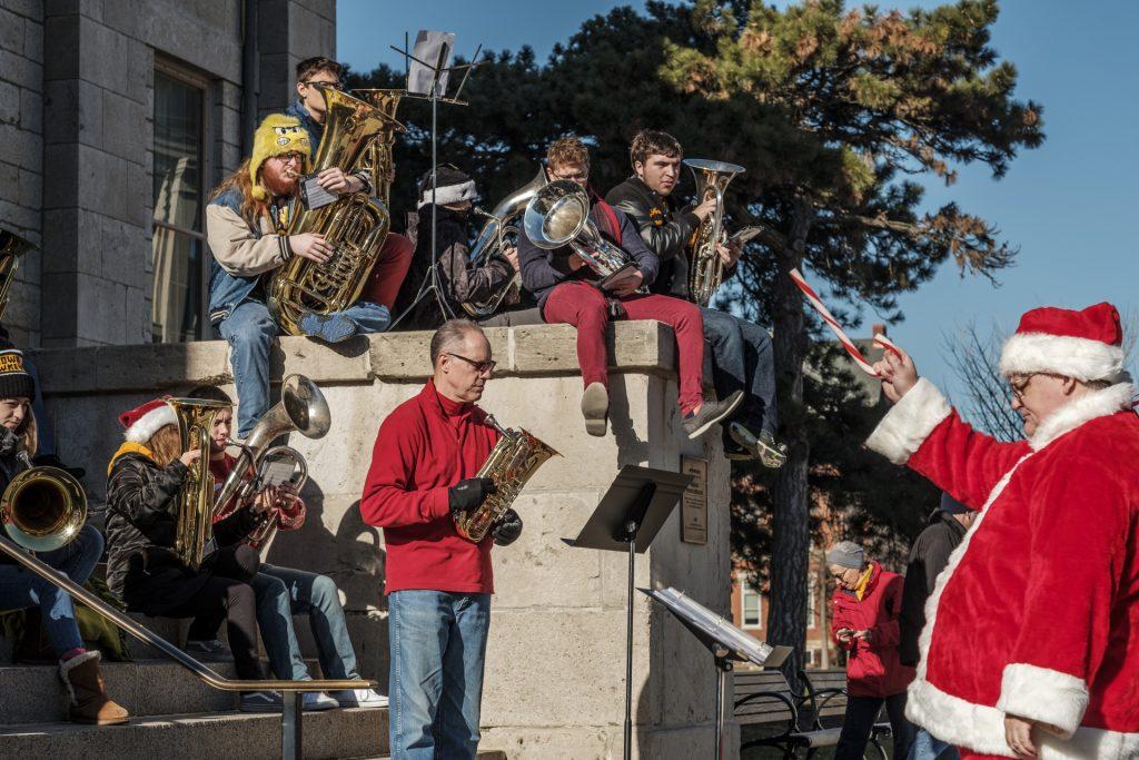 The UI Tuba and Euphonium Ensemble performs in front of the Old Capitol Museum on Friday Nov. 9th, 2017. The Ensemble performs on the Pentacrest annually to celebrate the holiday season. (Nick Rohlman/The Daily Iowan)