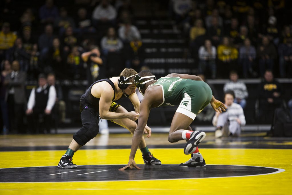 Iowa’s 125-pound Spencer Lee wrestles Michigan State’s Rayvon Foley during an Iowa/Michigan State wrestling matchup in Carver-Hawkeye Arena on Friday, Jan. 5, 2018. Lee pinned Foley in 0:46. (Joseph Cress/The Daily Iowan)