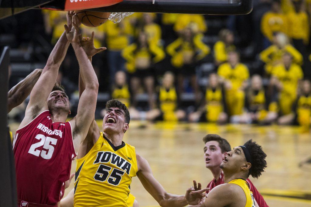 Iowas+Luka+Garza+%2855%29+and+Wisconsins+Alex+Illikainen+%2825%29+jump+for+the+rebound+during+the+NCAA+mens+basketball+game+between+Iowa+and+Wisconsin+at+Carver-Hawkeye+Arena+on+Tuesday%2C+Jan.+23%2C+2018.+The+Hawkeyes+are+going+into+the+game+with+a+conference+record+of+1-7.+Iowa+went+on+to+defeat+Wisconsin%2C+85-67.+%28Ben+Allan+Smith%2FThe+Daily+Iowan%29