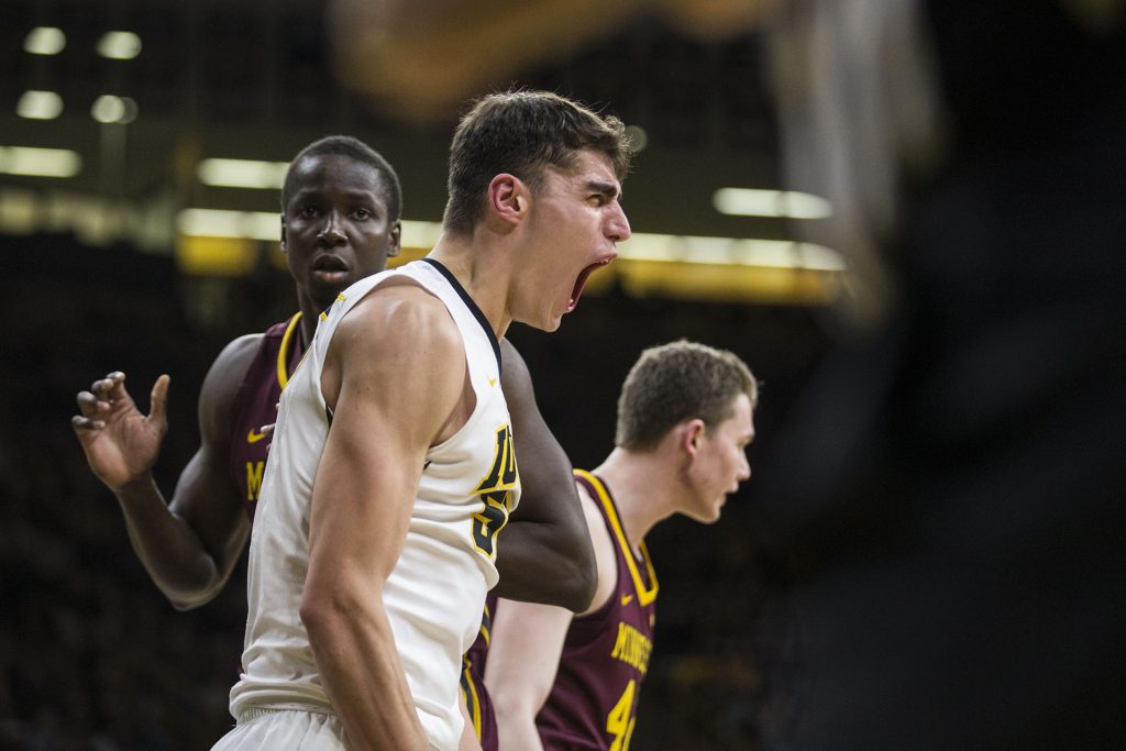 Iowa forward Luka Garza (55) celebrates after making a contested shot during the NCAA mens basketball game between Iowa and Minnesota at Carver-Hawkeye Arena on Tuesday, Jan. 30, 2018. 