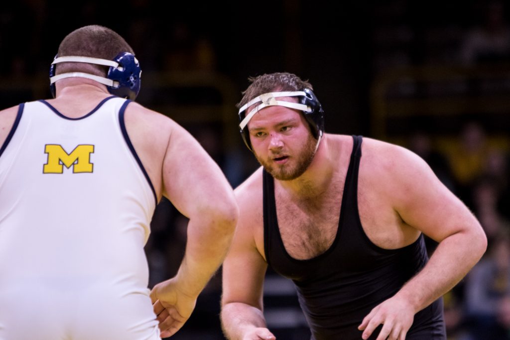 Iowa+wrestler+Sam+Stoll+sizes+up+Michigan+wrestler+Adam+Coon+at+Carver-Hawkeye+Arena+on+Saturday%2C+Jan.+27%2C+2018.+The+Wolverines+defeated+the+Hawkeyes+19-17.%0A+%28David+Harmantas%2FThe+Daily+Iowan%29