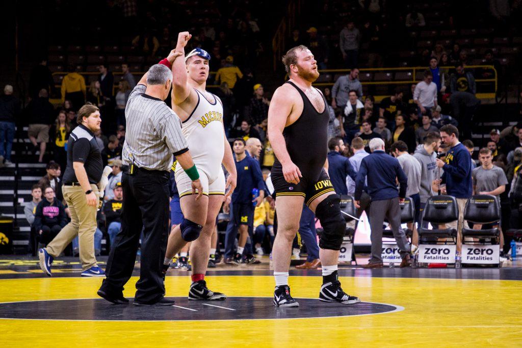 Iowa+wrestler+Sam+Stoll+walks+off+the+mat+after+losing+his+match+to+Michigan+wrestler+Adam+Coon+at+Carver-Hawkeye+Arena+on+Saturday%2C+Jan.+27%2C+2018.+The+Wolverines+defeated+the+Hawkeyes+19-17.%0A+%28David+Harmantas%2FThe+Daily+Iowan%29