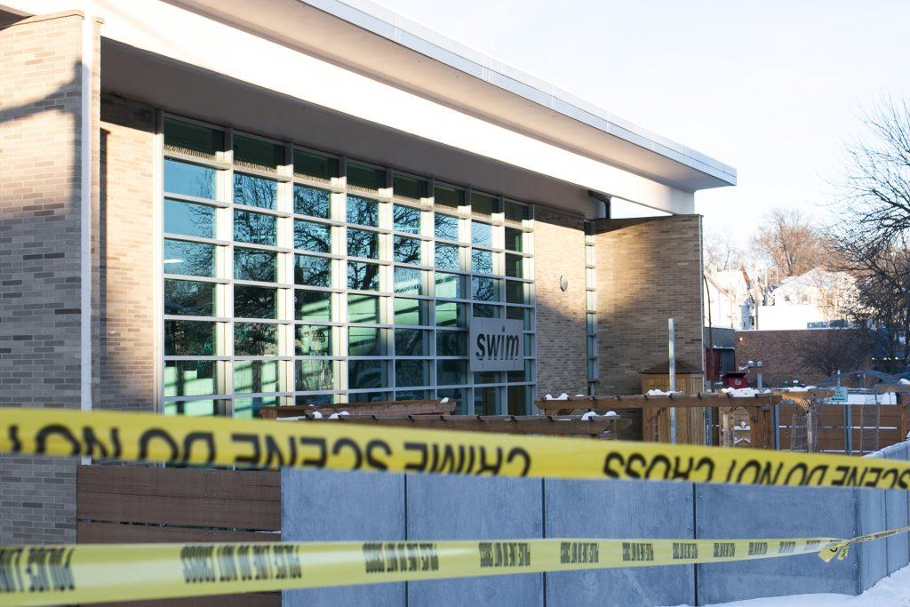 Iowa City Police and the Johnson County Medical Examiners respond to a scene in the edible classroom garden area of the Robert A. Lee Recreation Center in Iowa City on the corner of Burlington and Gilbert Streets on Tuesday, Jan. 2, 2018. The Medical Examiners left with a body. (Joseph Cress/The Daily Iowan)