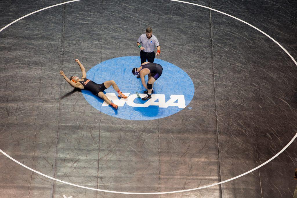 A wrestler celebrates his victory during the 2017 NCAA Division I Wrestling Championships in the Scottrade Center in St. Louis, Missouri on Friday, March 17, 2017. Day two of the National Championships shrinks the number of competitors down to the final competition for the Championship match on Saturday. (The Daily Iowan/Anthony Vazquez)