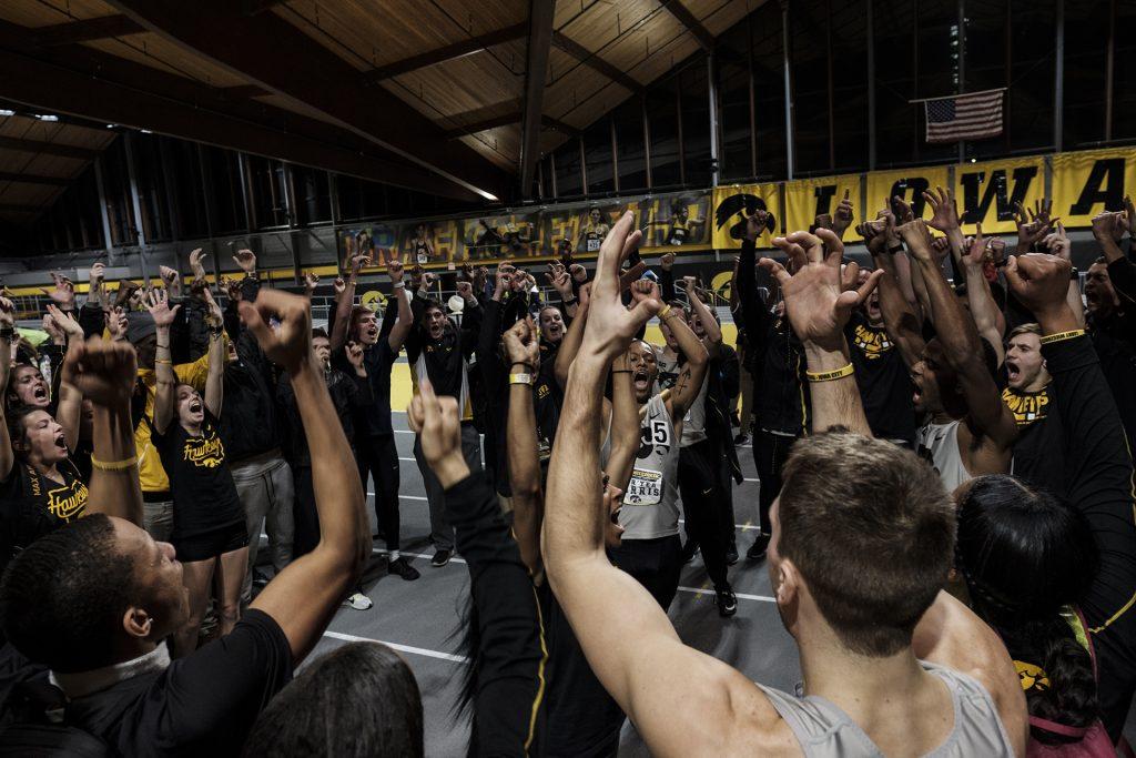 The Iowa men’s and women’s track teams celebrate after the Larry Wieczorek Invitational on Saturday, Jan. 20, 2018. (Nick Rohlman/The Daily Iowan)