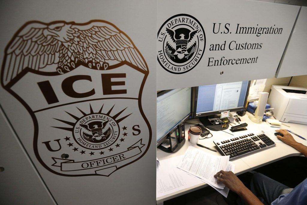 An unidentified Immigration and Customs Enforcement deportation officer reviews forms at the the Pacific Enforcement Response Center in Laguna Niguel, Calif., in an April 26, 2017, file image. (Allen J. Schaben/Los Angeles Times/TNS)