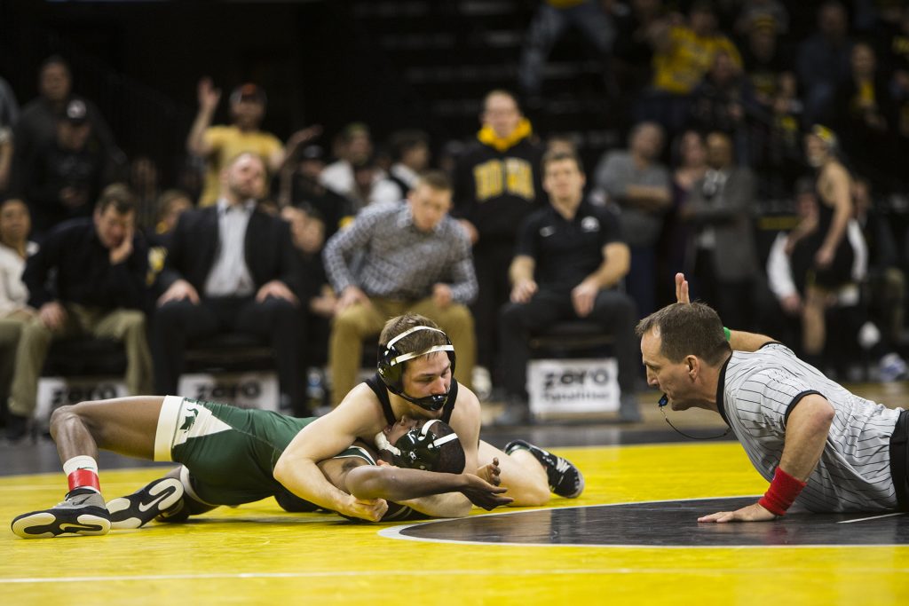 Iowa’s 125-pound Spencer Lee pins Michigan State’s Rayvon Foley during an Iowa/Michigan State wrestling matchup in Carver-Hawkeye Arena on Friday, Jan. 5, 2018. Lee pinned Foley in 0:46. (Joseph Cress/The Daily Iowan)