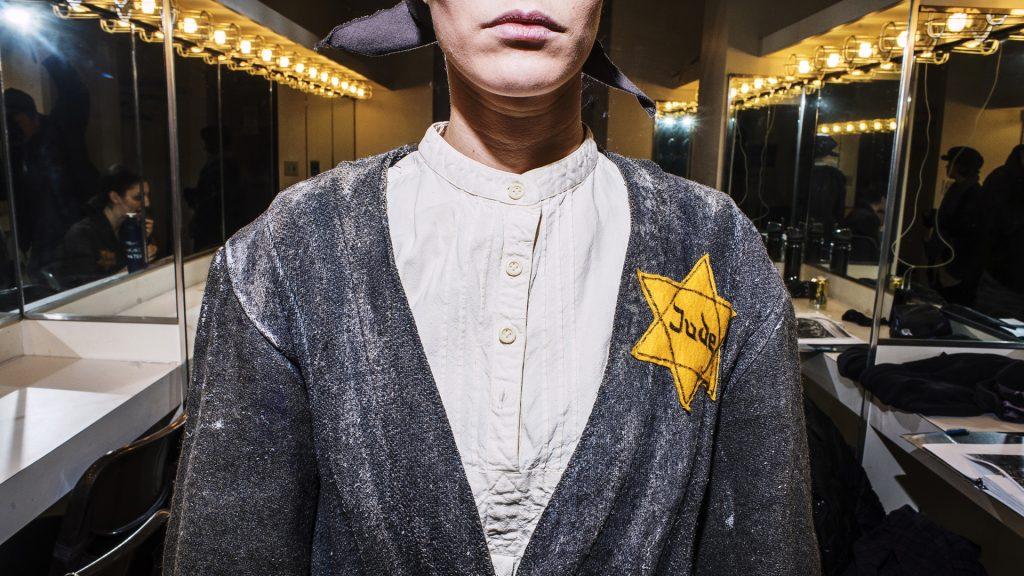 In this photo illustration, Elyse Fisher, an actress in the UI Theater Department, poses for a portrait before the dress rehearsal for Dybbuk of Dachau. (James Year/The Daily Iowan)