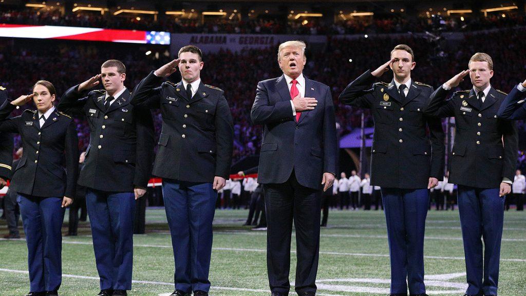 President Donald Trump participates in the national anthem at the College Football Playoff National Championship at Mercedes-Benz Stadium on Monday, Jan. 8, 2018 in Atlant, Ga. (Curtis Compton/Atlanta Journal-Constitution/TNS)