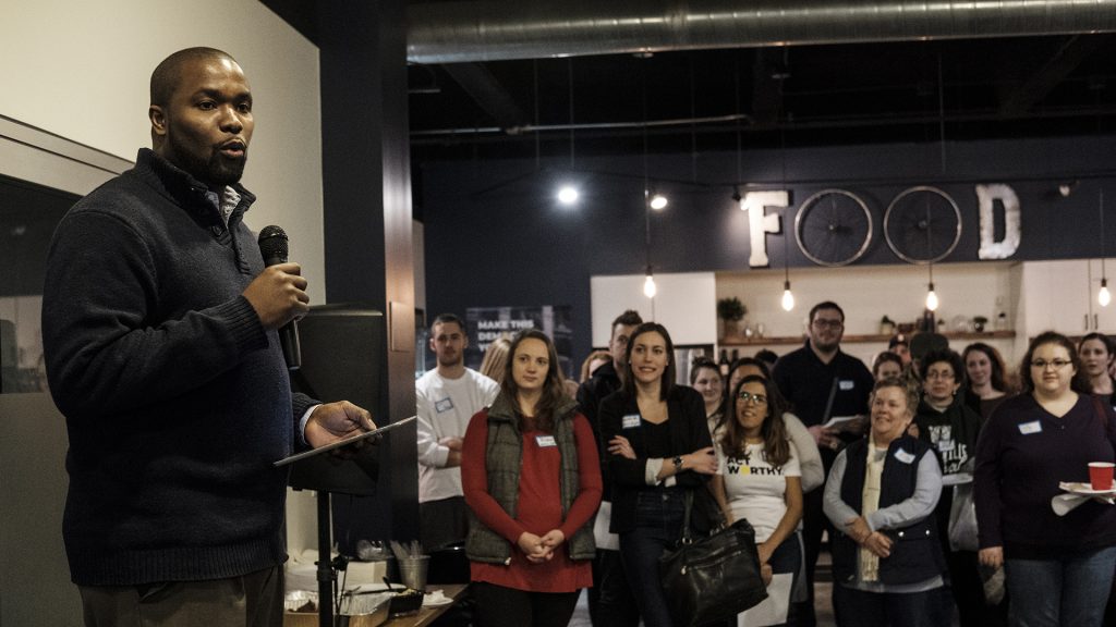 Iowa City Council member Kingsley Botchway speaks during the launch party for ActWorthy at Merge on Monday, Jan. 15, 2018. Speakers at the event adressed a cause they personally advocated for or were involved with and networked with other members of the community. (Nick Rohlman/The Daily Iowan)