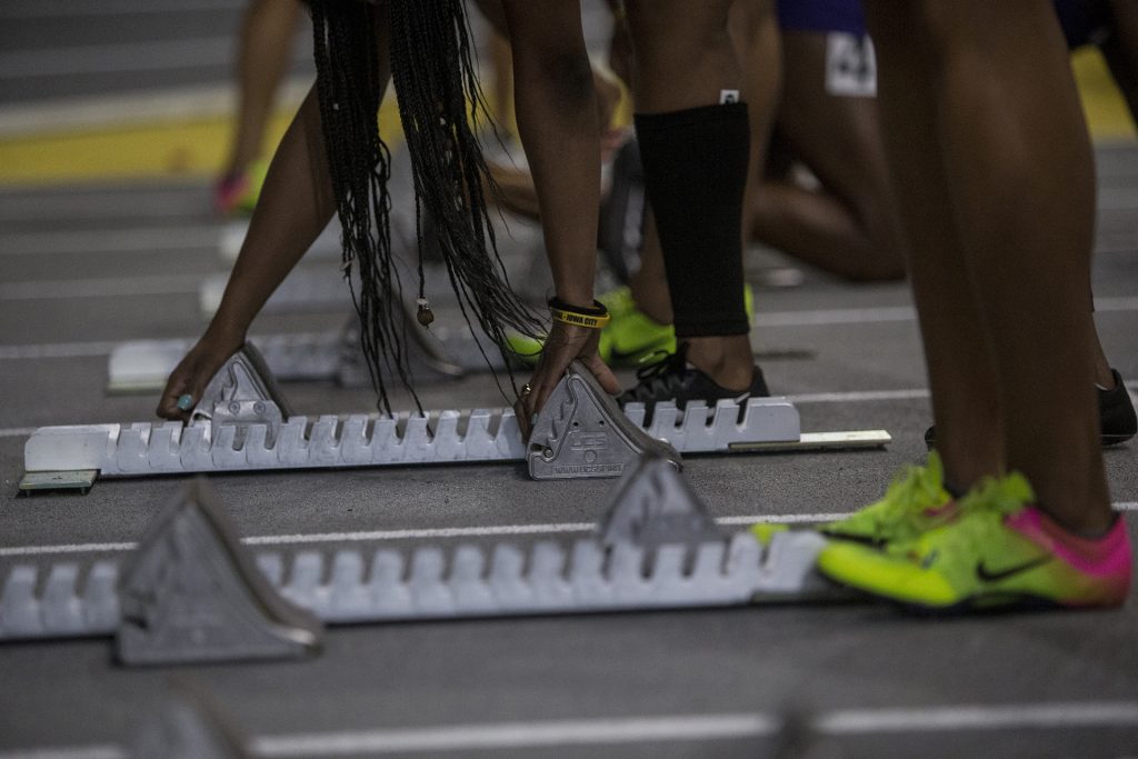 Athletes prepare to take their marks during the Larry Wieczorek Invitational on Saturday, Jan. 20, 2017. (Nick Rohlman/The Daily Iowan)