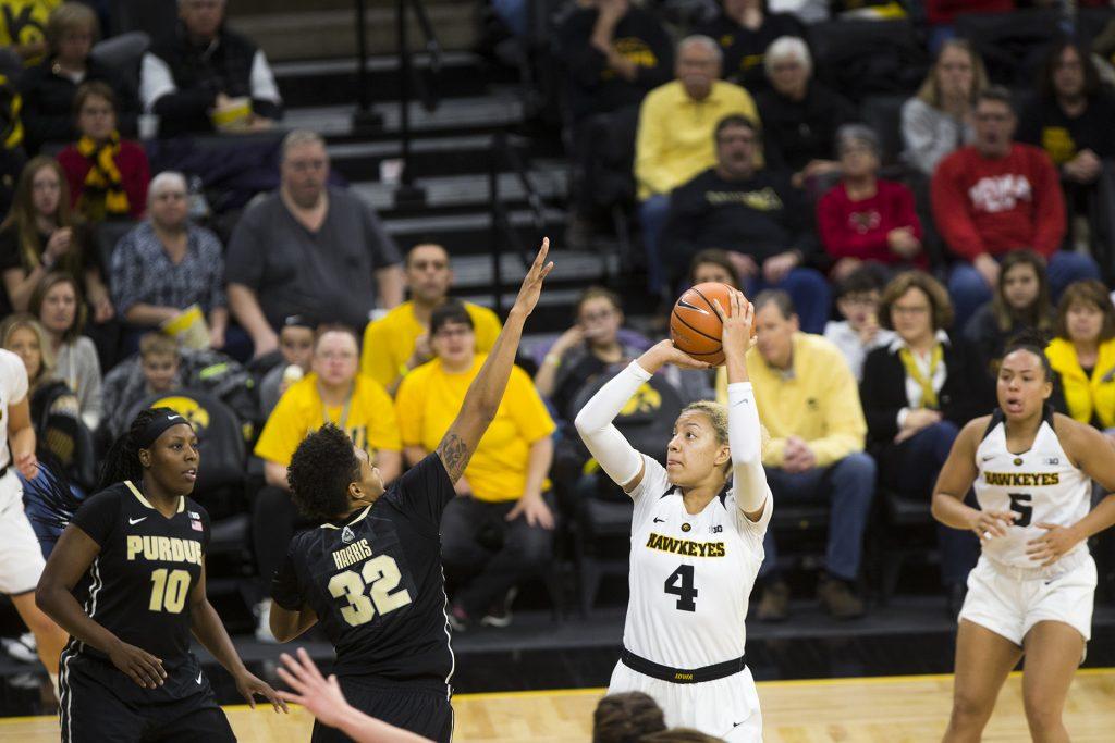 Iowa forward Chase Coley shoots over Purdue forward AeRianna Harris during an Iowa/Purdue womens basketball game in Carver-Hawkeye Arena on Saturday, Jan. 13, 2018. The Boilermakers defeated the Hawkeyes, 76-70. (Joseph Cress/The Daily Iowan)