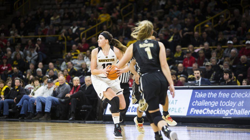 Iowa center Megan Gustafson looks to pass during an Iowa/Purdue womens basketball game in Carver-Hawkeye Arena on Saturday, Jan. 13, 2018. The Boilermakers defeated the Hawkeyes, 76-70. (Joseph Cress/The Daily Iowan)