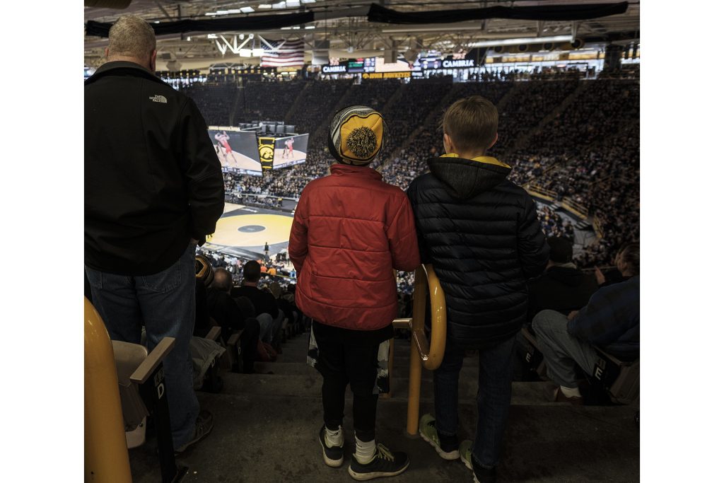 Two young fans look on during the Iowa-Oklahoma State dual meet on Sunday Jan. 14, 2018. The Hawkeyes defeated the Cowboys 20-12. (Nick Rohlman/The Daily Iowan)