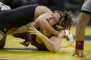 Minnesotas 133-pound Mitch McKee competes against Iowas Paul Glynn during the NCAA wrestling match between Iowa and Minnesota at Carver-Hawkeye Arena on Friday, Feb. 2, 2018. 