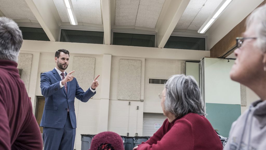 Candidate for the Iowa State Legislature and UI alum Zach Wahls speaks to Iowa City residents during the off season gubernatorial Democratic caucuses at Iowa City-West High School on Monday, Feb. 5, 2018. Representatives for candidates such as Fred Hubbell, Nate Boulton, John Norris, and Deidre Dejear were in attendance. (Ben Allan Smith/The Daily Iowan)