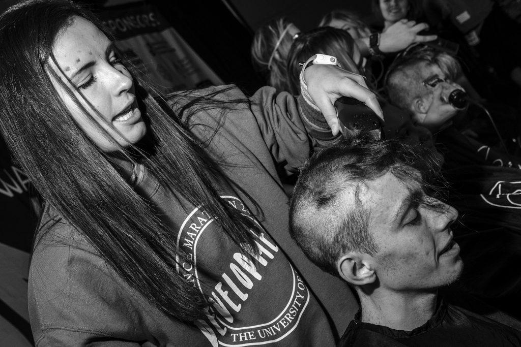 Orson Codd has his head shaved during Dance Marathon at the Iowa Memorial Union on Saturday, Feb. 3, 2018. Codd said he shaved his head because he wanted to "try something new at Dance Marathon. I don't know how many other times I'm gonna say: let's shave my head. (Nick Rohlman/The Daily Iowan)