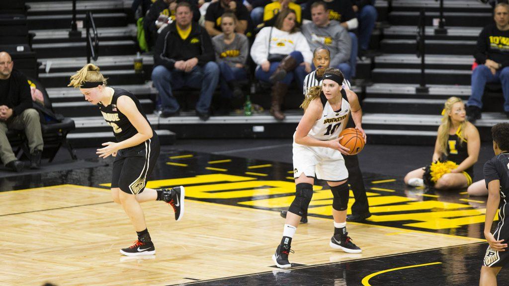 Iowa center Megan Gustafson pulls down a rebound during an Iowa/Purdue womens basketball game in Carver-Hawkeye Arena on Saturday, Jan. 13, 2018. The Boilermakers defeated the Hawkeyes, 76-70. (Joseph Cress/The Daily Iowan)