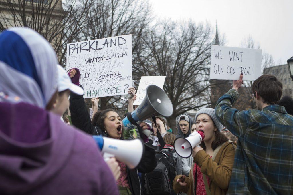 From left: Iowa City High School junior Olivia Lusala and senior Eden Knoop lead a protest on the Pentacrest on Monday, Feb. 19, 2018. The protest was sparked after news of another school shooting, at Marjory Stoneman Douglas High School, in Parkland, FL on, Feb. 14. (Lily Smith/The Daily Iowan)