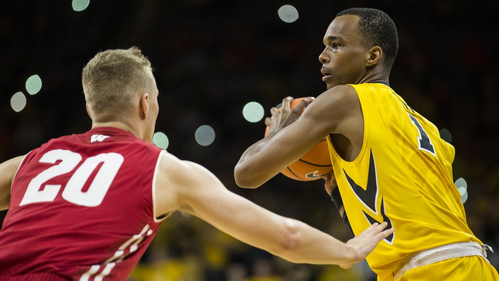 Iowa+guard+Maishe+Dailey+%281%29+looks+for+an+open+pass+around+Wisconsins+T.J.+Schlundt+%2820%29+during+the+NCAA+mens+basketball+game+between+Iowa+and+Wisconsin+at+Carver-Hawkeye+Arena+on+Tuesday%2C+Jan.+23%2C+2018.+The+Hawkeyes+are+going+into+the+game+with+a+conference+record+of+1-7.+Iowa+went+on+to+defeat+Wisconsin+85-67.+%28Ben+Allan+Smith%2FThe+Daily+Iowan%29