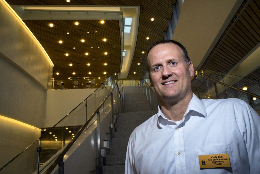 Assistant Professor Craig Just poses for a portrait in Hancher Auditorium on Thursday, Feb 15, 2018. Professor Just's work in civil and environmental engineering focuses on the nitrogen cycle and if freshwater mussels can help clean polluted areas. (James Year/The Daily Iowan)