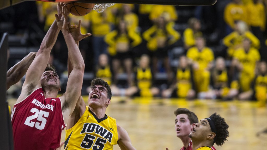 Iowas+Luka+Garza+%2855%29+and+Wisconsins+Alex+Illikainen+%2825%29+jump+for+the+rebound+during+the+NCAA+mens+basketball+game+between+Iowa+and+Wisconsin+at+Carver-Hawkeye+Arena+on+Tuesday%2C+Jan.+23%2C+2018.+%28Ben+Allan+Smith%2FThe+Daily+Iowan%29