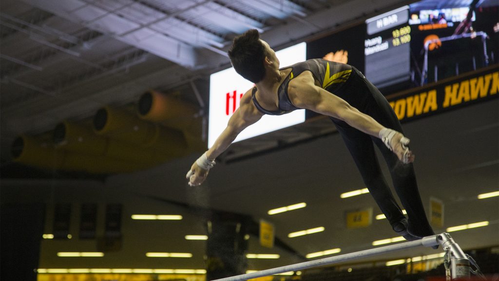 during the Iowa/Illinois mens gymnastics meet at Carver-Hawkeye Arena on Saturday, Feb. 3, 2018. The Fighting Illini defeated the Hawkeyes, 404.700-401.850, to lose their home opener. (Lily Smith/The Daily Iowan)
