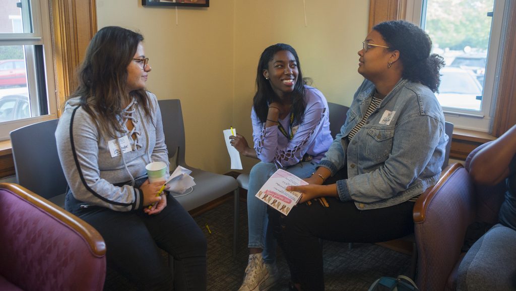 From left: UI students Lina Khodor, Felicia Ogunsanya, and Fatima Tall mingle during the Womxn of Colour Welcome Mixer at the Womens Resource and Action Center on Wednesday, Sep. 6, 2017. It was the inaugural event for the Womxn of Colour Network Series, and will feature a monthly program on a topic affecting womxn of color. (Lily Smith/The Daily Iowan)