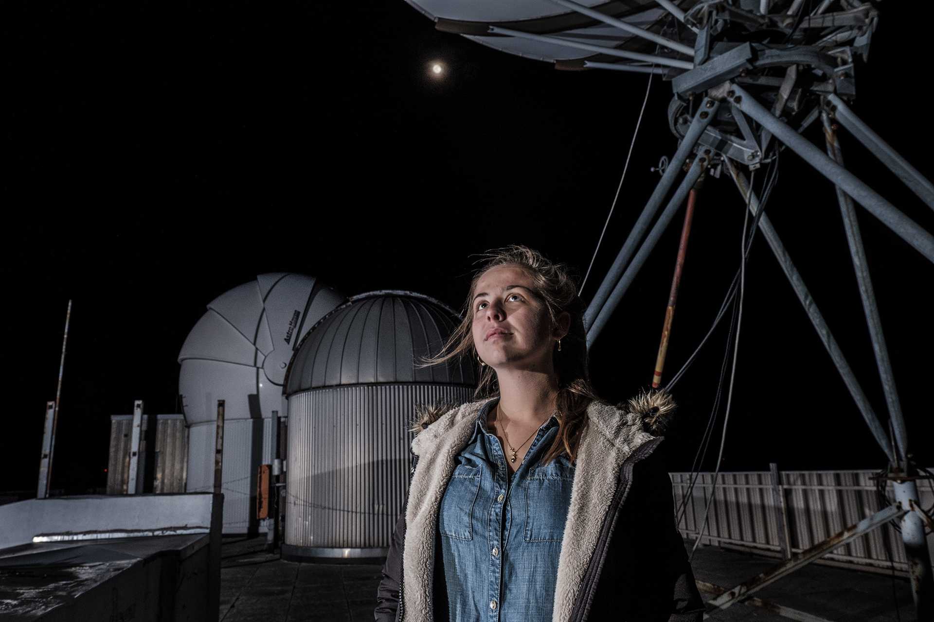 UI sophomore Hannah Gulick poses for a portrait on the in front of the observatory on the roof of Van Allen Hall on Wednesday, Jan. 31, 2018. Gulick helped to design a satellite which will be launched into space this spring. (Nick Rohlman)