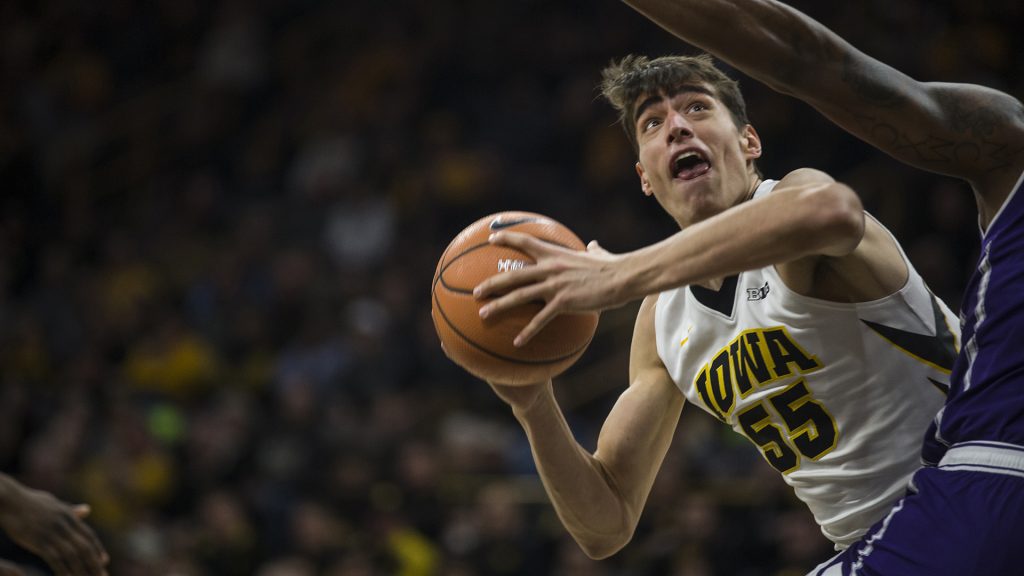 Iowas+Luka+Garza+%2855%29+attempts+a+shot+during+the+Senior+Day+mens+basketball+game+between+Iowa+and+Northwestern+at+Carver-Hawkeye+Arena+on+Sunday%2C+Feb.+25%2C+2018.+The+Hawkeyes+defeated+the+Wildcats+77-70.+%28Ben+Allan+Smith%2FThe+Daily+Iowan%29