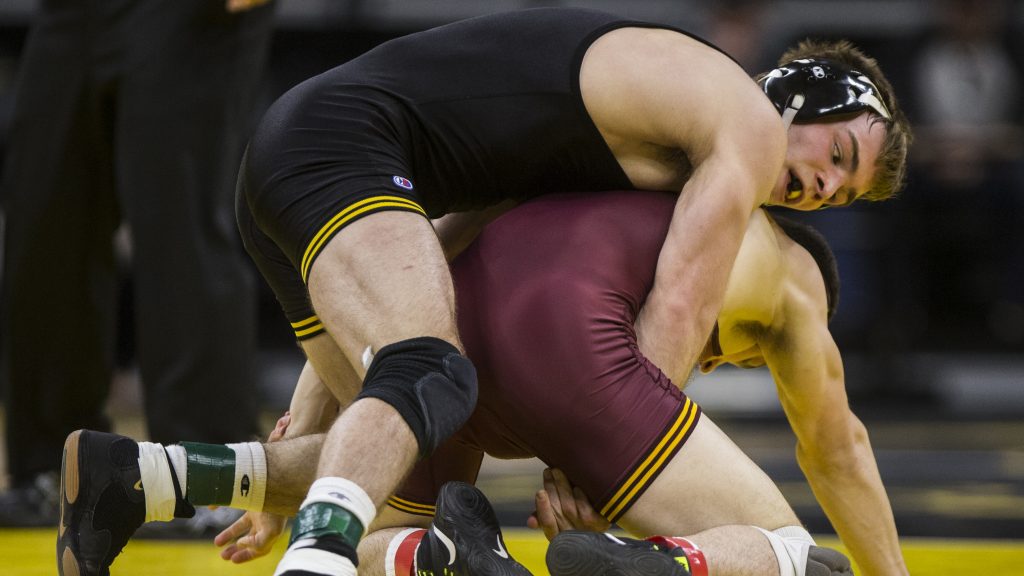 Iowas 149-pound Brandon Sorensen competes against Minnesotas Ben Brancale during the NCAA wrestling match between Iowa and Minnesota at Carver-Hawkeye Arena on Friday, Feb. 2, 2018. The #2 ranked Sorensen beat Brancale in 3:32 fall. The Hawkeyes defeated the Golden Gophers 34-7. (Ben Allan Smith/The Daily Iowan)