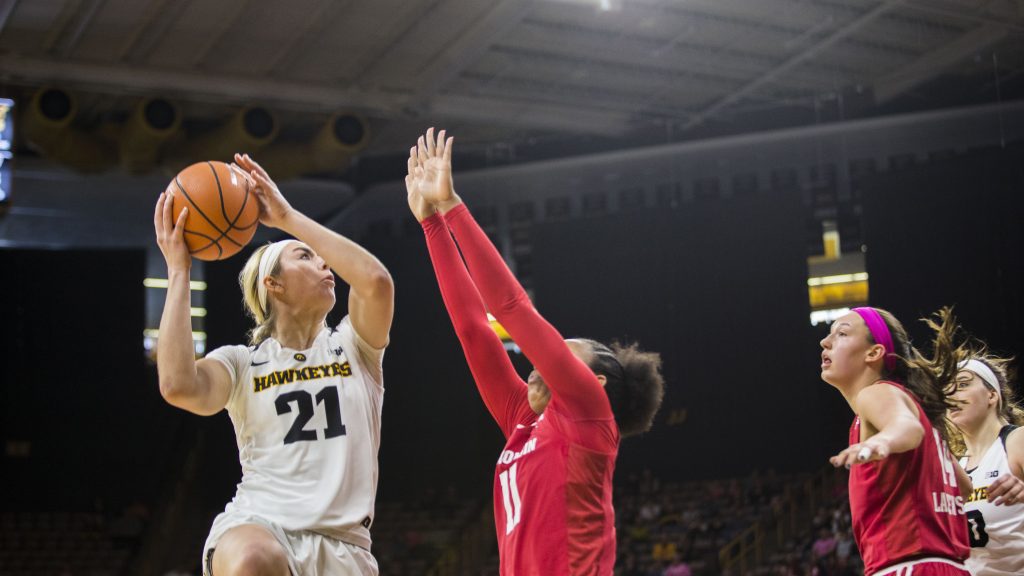 Iowa forward Hannah Stewart attempts a shot during the Iowa/Wisconsin basketball game at Carver-Hawkeye Arena on Sunday, Feb. 18, 2018. The Hawkeyes defeated the Badgers, 88-61. (Lily Smith/The Daily Iowan)
