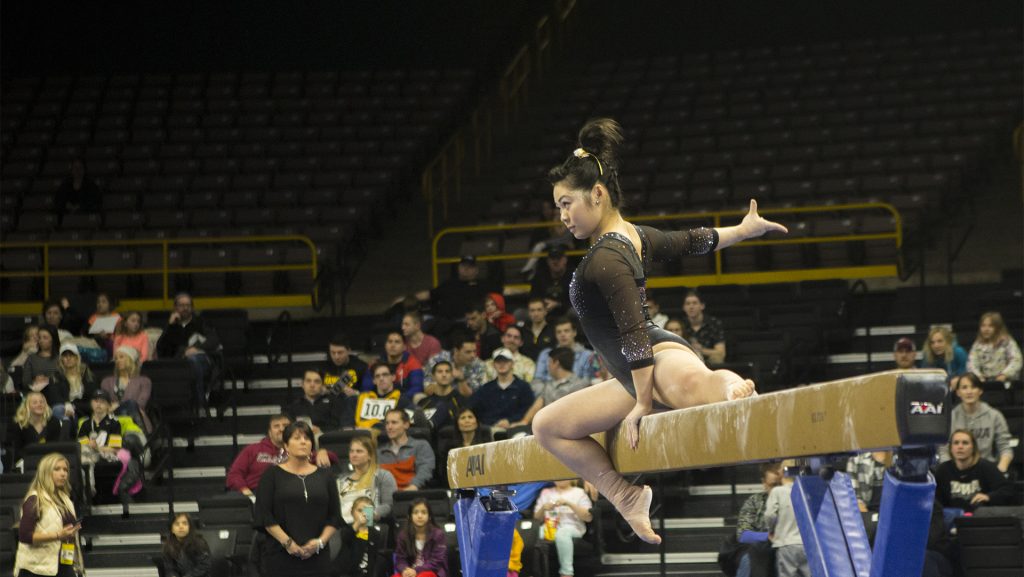 Iowas+Clair+Kaji+performs+on+the+beam+during+the+Iowa%2FOhio+State+gymnastics+meet+in+Carver-Hawkeye+Arena+on+Friday%2C+Jan.+19%2C+2018.+The+GymHawks+defeated+the+Buckeyes%2C+195.725+to+195.300%2C+to+win+their+home+opener.+%28Lily+Smith%2FThe+Daily+Iowan%29