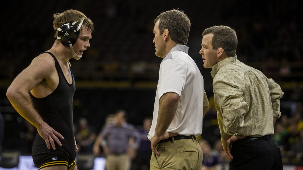 Iowa+Head+Coaches+Tom+and+Terry+Brands+speak+with+%232+ranked+149+pound+wrestler+Brandon+Sorenson+during+the+Iowa+vs.+Northwestern+dual+meet+on+Sunday%2C+Feb.+4%2C+2018.+The+Hawkeyes+defeated+the+wildcats+33-2.+%28Nick+Rohlman%2FThe+Daily+Iowan%29