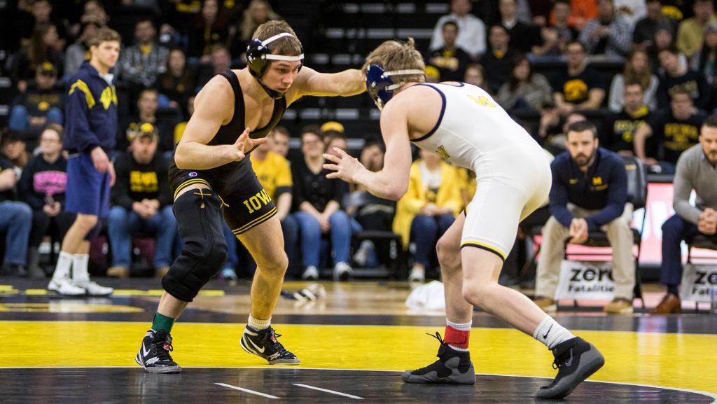 Iowa wrestler Spencer Lee grapples with Michigan wrestler Drew Martin at Carver-Hawkeye Arena on Saturday, Jan. 27, 2018. The Wolverines defeated the Hawkeyes 19-17. (David Harmantas/The Daily Iowan)