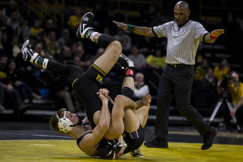 Iowa's #2 ranked Michael Kemerer wrestles Northwestern's Shane Oster during the Iowa vs. Northwestern dual meet on Sunday, Feb. 4, 2018. Kemerer won a tech fall, 17-2. The Hawkeyes defeated the wildcats 33-2. (Nick Rohlman/The Daily Iowan)