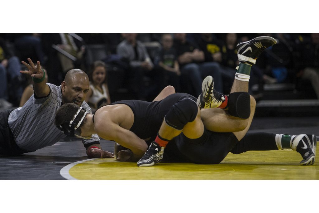 Iowa's Michael Kemerer scores a 4 point near fall against  Northwestern's Shane Oster during the Iowa vs. Northwestern dual meet on Sunday, Feb. 4, 2018. The Hawkeyes defeated the wildcats 33-2. (Nick Rohlman/The Daily Iowan)