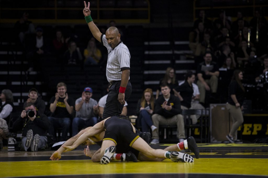 Iowa 141 pound wrestler Vince Turk takes down Northwestern's Alec McKenna during the Iowa vs. Northwestern dual meet on Sunday, Feb. 4, 2018. Turk won a major decision 10-2. The Hawkeyes defeated the wildcats 33-2. (Nick Rohlman/The Daily Iowan)