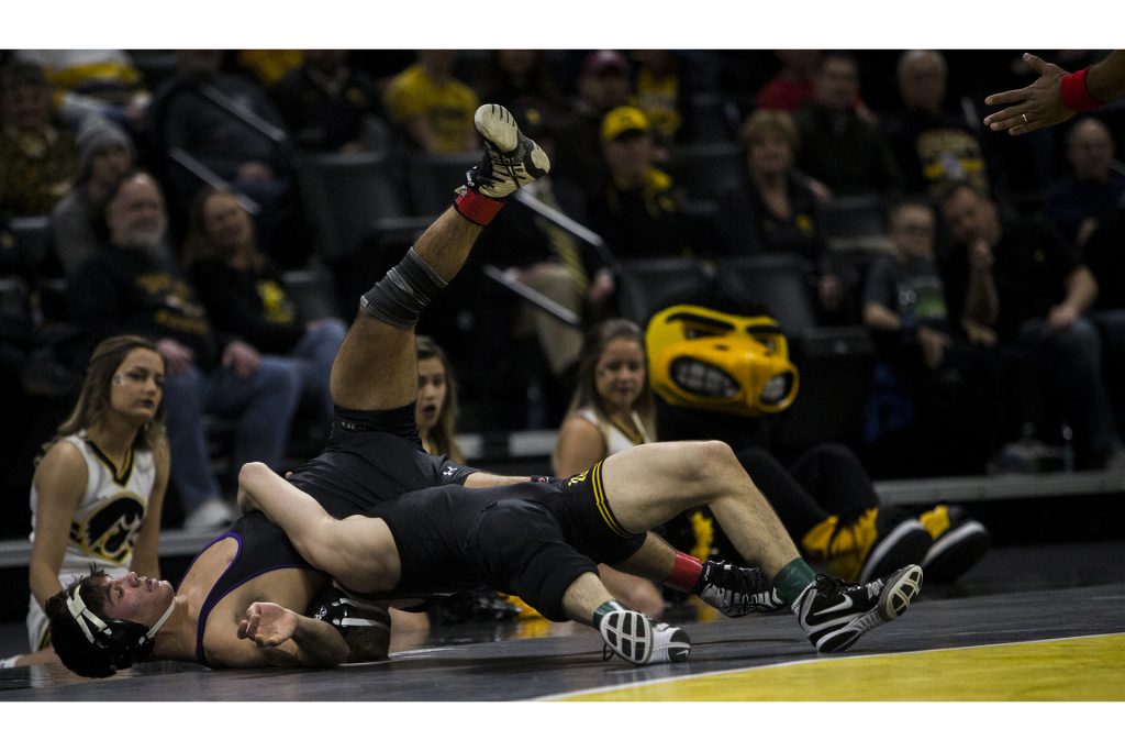 Iowa's #3 ranked 125 pound Spencer Lee wrestles Northwestern's #10 ranked Sebastian Rivera during the Iowa vs. Northwestern dual meet on Sunday, Feb. 4, 2018. The Hawkeyes defeated the wildcats 33-2. (Nick Rohlman/The Daily Iowan)