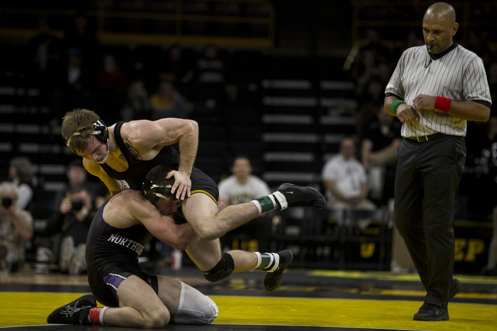 Iowa;s #2 ranked Brandon Sorenson wrestles Northwestern's #5 ranked Ryan Deakin during the Iowa vs. Northwestern dual meet on Sunday, Feb. 4, 2018. Sorenson won a decision 5-4. The Hawkeyes defeated the wildcats 33-2. (Nick Rohlman/The Daily Iowan)