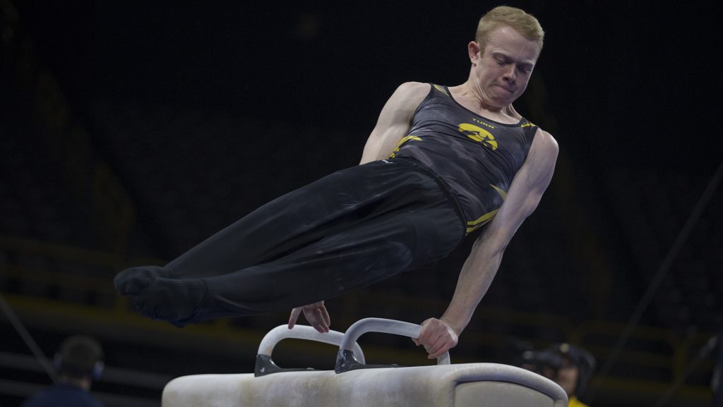 Nick+Merryman+competes+on+the+pommel+during+mens+gymnastics+Iowa+vs.+Penn+State+and+Arizona+State+on+Mar.+3%2C+2018+at+Carver+Hawkeye+Arena.+Merryman+earned+13.350+for+his+performance.+The+Hawkeyes+defeated+the+Lions+and+the+Sun+Devils+404.050+to+396.550+and+376.150.+%28Katie+Goodale%2FThe+Daily+Iowan%29